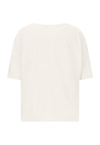 T-shirt w kolorze kremowym z bawełny, charakteryzujący się luźnym krojem, opadającymi ramionami i krótkimi rękawami. Gładka tekstura, prosty design, brak widocznego brandingu.