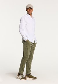 Shiwi CORDUROY RIB - Spodnji deli trenirk - uniform green