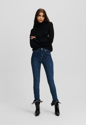Kitsa lõikega teksad - washed dark blue