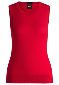 Top rosso senza maniche realizzato in superfine lana merino, con scollatura e orlo a coste, dalla texture liscia e aderente.