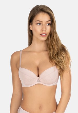 Light pink padded bra with lace overlay and a center bow detail, featuring adjustable straps and a smooth texture for comfort.