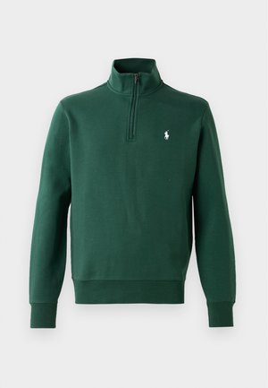Zielony sweatshirt z suwakem na ćwierć, wykonany z miękkiego materiału. Charakteryzuje się długimi rękawami, ściągaczem przy szyi oraz małym białym logo na piersi.