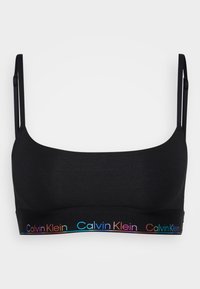 Svart bralette laget av myk stoff med justerbare stropper. Har en fargerik Calvin Klein-logo langs kanten.