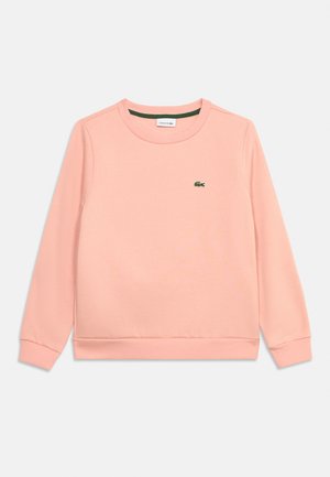 Hellrosa Langarm-Sweatshirt mit Rundhalsausschnitt, gerippten Bündchen und Saum, mit kleinem grünem Krokodil-Logo auf der linken Brust.