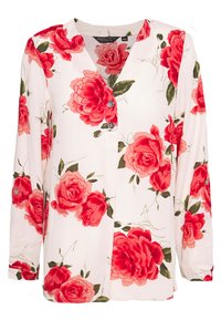 Blouse florale en tissu blanc avec de grandes roses rouges et des feuilles vertes. Détails de boutons à l'avant ; manches longues avec poignets boutonnés.