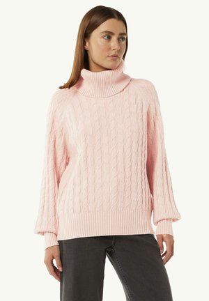 Cable-knit sweater in light pink with a high, ribbed turtleneck. Features loose sleeves and a ribbed hem for a relaxed fit.