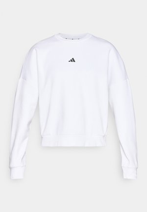Hvit cropped sweatshirt laget av mykt stoff, med rund hals, lange ermer og en liten svart Adidas-logo på brystet.