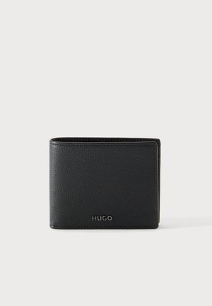 Black textured leather bi-fold wallet with silver "HUGO" logo on front facing side on plain light background.