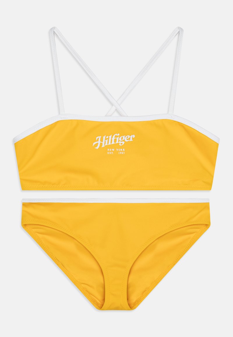 Yellow bikini set featuring a bandeau top with white trim and crossed straps, paired with matching low-rise bottoms. Cotton-like texture.