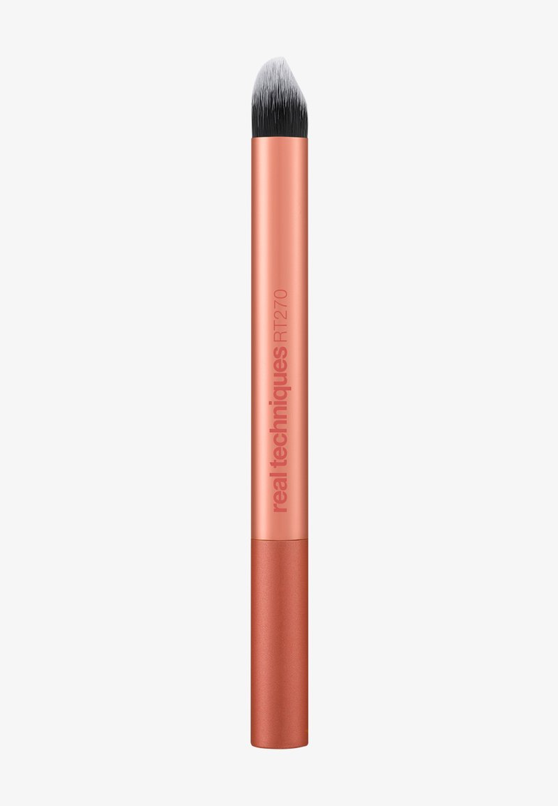 Schräger Make-up-Pinsel mit schwarz-weißen Borsten und metallisch roségoldfarbenem Griff, beschriftet mit "real techniques RT270".