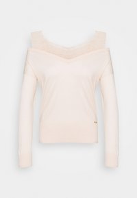 Bluzka odsłaniająca ramiona w miękkiej, beżowej tkaninie, z koronkową lamówką wzdłuż dekoltu i dopasowanymi długimi rękawami. Delikatna prążkowana faktura i detal z logo.