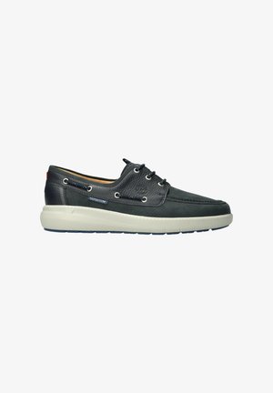 Chaussures en cuir bleu foncé avec un design texturé, une semelle intermédiaire blanche, des accents perforés et des œillets en métal pour les lacets.