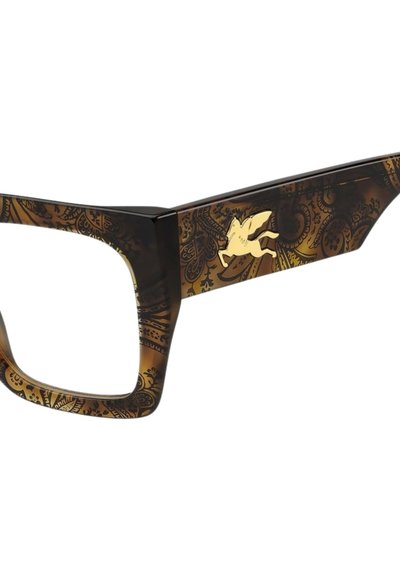 Occhiali con montatura spessa color marrone decorata con motivi paisley dettagliati e un accento dorato raffigurante una figura alata.