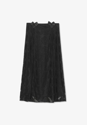 Gonna nera in pizzo con motivo floreale, caratterizzata da due fiocchi in satin in vita. Design fluido, tessuto testurizzato e lunghezza al ginocchio.