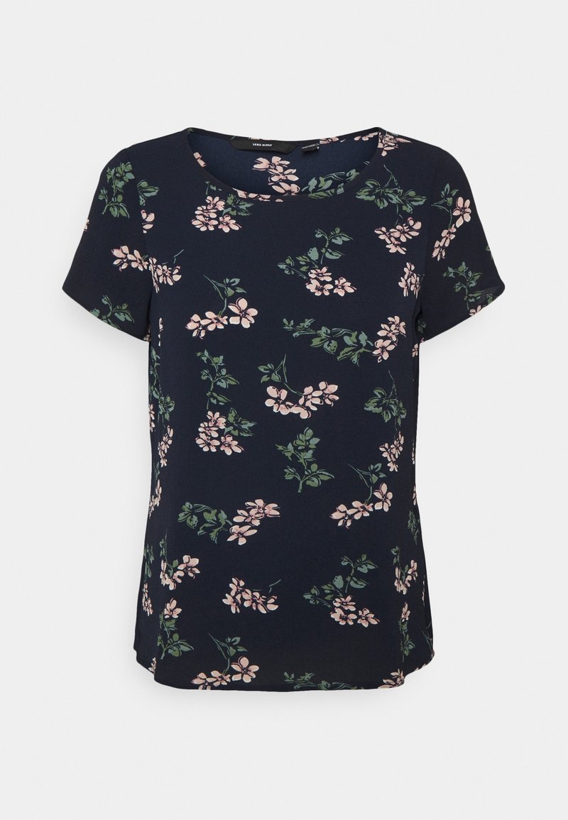 Floral short-sleeve top in navy fabric with pink and green botanical print. Features a rounded neckline and relaxed fit with side slits.