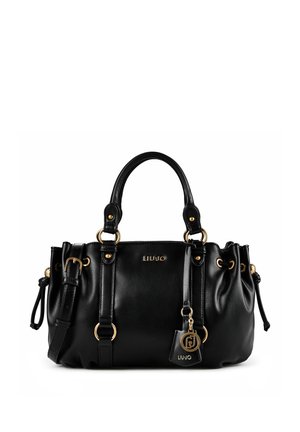 Sac à main en cuir noir Liu Jo avec double poignée, ferrures dorées, bandoulière réglable et breloque de marque sur fond blanc.