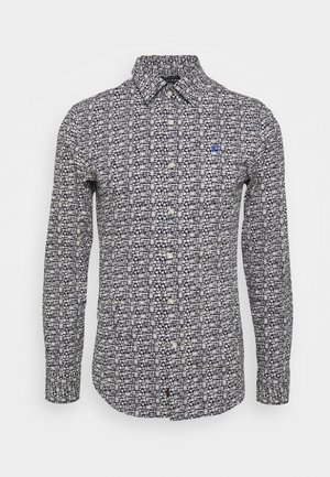 Herre slim-fit langærmet skjorte med knapper, sort og hvidt geometrisk mønster og lille blåt logo på venstre bryst.