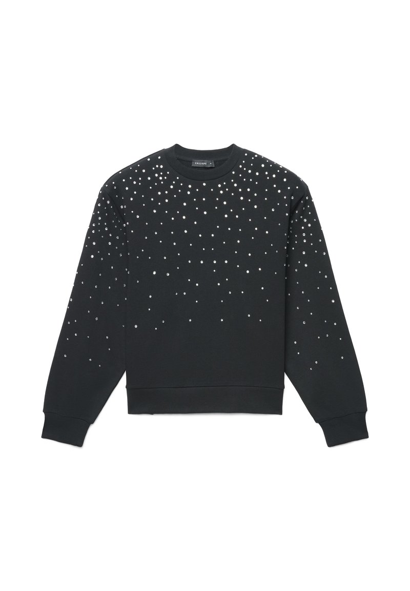 Felpa nera con applicazioni rotonde sparse sulla parte anteriore, scollo rotondo e polsini e orlo a costine. Tessuto morbido al tatto.