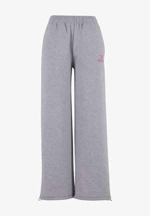 Graue lockere Sweatpants aus weichem Stoff, mit einem elastischen Bund und einem kleinen rosa Logo-Detail an der Seite.