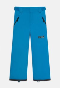 Pantalons de ski imperméables bleus avec poches zippées, pattes de taille ajustables et logo noir HH sur la cuisse droite.