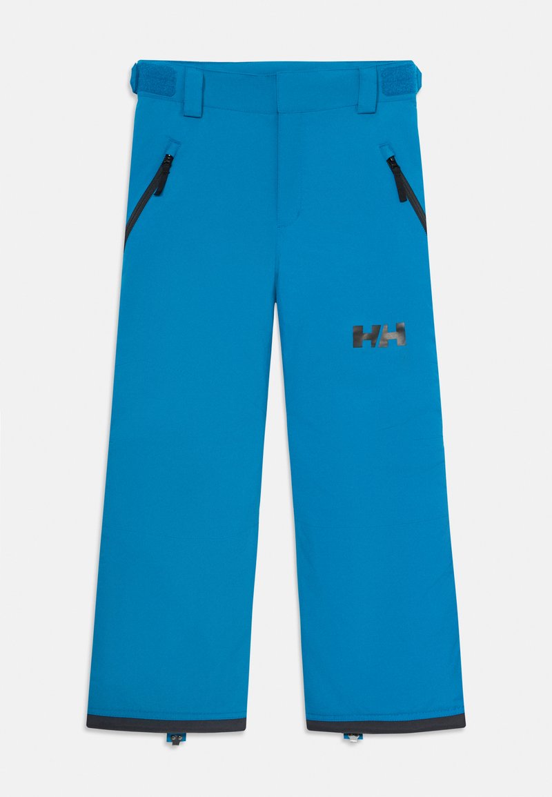 Pantalons de ski imperméables bleus avec poches zippées, pattes de taille ajustables et logo noir HH sur la cuisse droite.