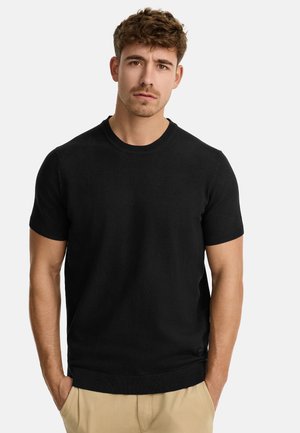 Black short-sleeve crewneck sweater with a fitted design, textured fabric, and ribbed cuffs and hem. Minimalistic style with no visible logos.