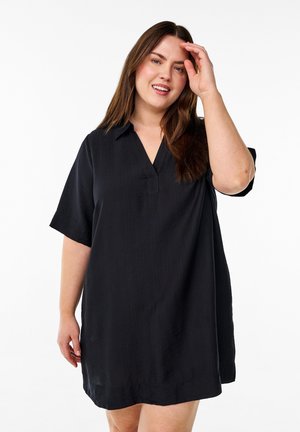 Black short-sleeve dress with a collar and v-neckline. Made from smooth fabric, featuring a relaxed fit and a hem that falls mid-thigh.