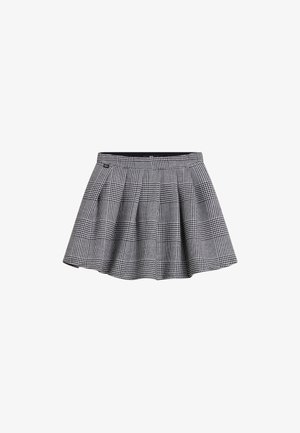 Mini-jupe plissée noire et blanche à motif à carreaux avec une ceinture ajustée, présentée sur un fond blanc uni.