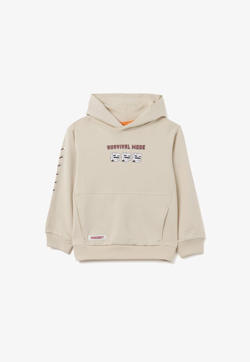 Sudadera con capucha beige con un forro naranja y bolsillo frontal. Presenta el texto y gráficos "MODO DE SUPERVIVENCIA" en el pecho y la manga.