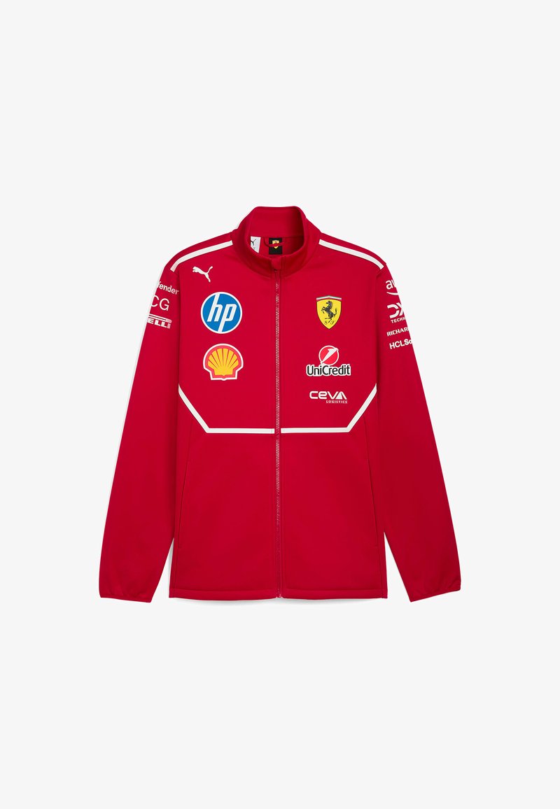Czerwona kurtka zapinana na zamek z wysokim kołnierzem; posiada loga Ferrari, HP, Shell i innych. Gładki materiał z białymi akcentami i szwami.