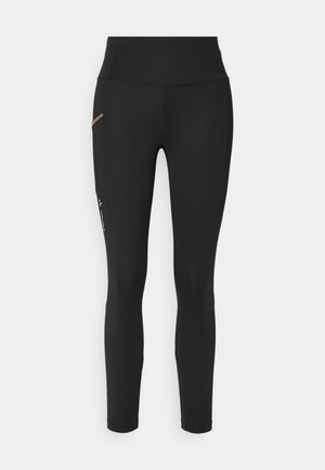 Schwarze, enganliegende Leggings aus dehnbarem Material, mit einem hohen Taillenbund und einer kleinen Seitentasche mit kontrastierendem Nahtdetail.