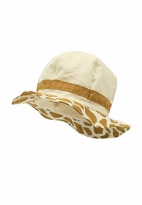 Gorra tipo bucket de tela beige con una banda marrón. El ala presenta un diseño de patrón de jirafa en marrón y crema.