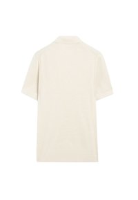 Polo en maille manches courtes blanc cassé avec col, vu de dos sur fond blanc.