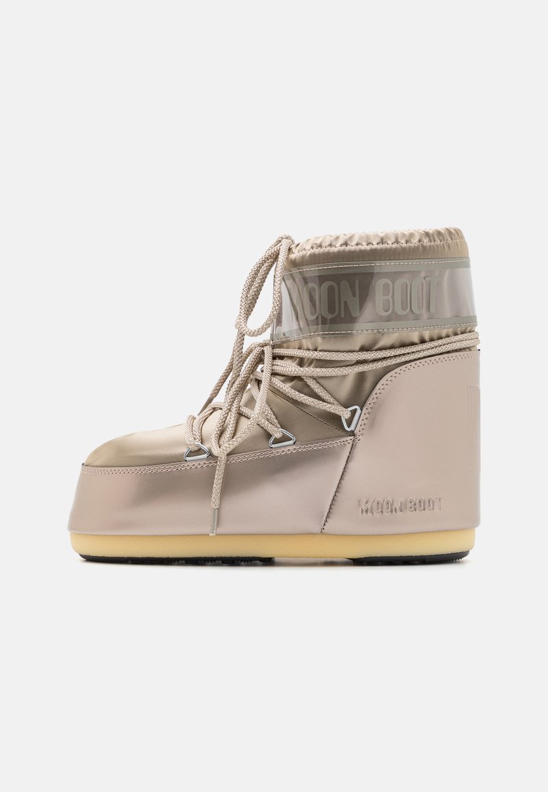 Beige Moon Boot with glossy upper material, elastic lace closure, and a padded cuff. Rubber outsole features a textured pattern for grip.