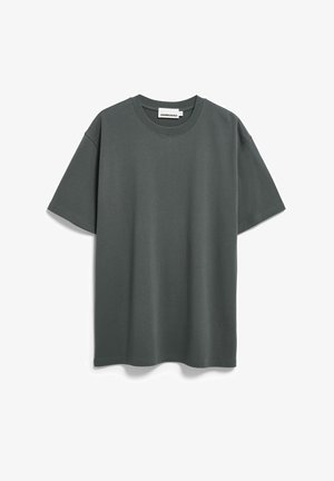 Dunkelgrünes T-Shirt mit kurzen Ärmeln aus weicher Baumwolle. Verfügt über einen klassischen Rundhalsausschnitt und einen lockeren Schnitt mit minimalen Nähtedetails.