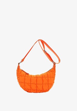 Bright orange quilted crescent-shaped shoulder bag with an adjustable strap and zippered closure on a white background.