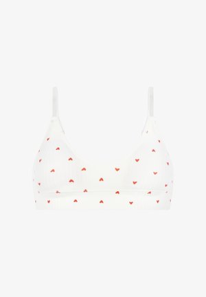 Bralette blanche côtelée avec un décolleté en V, ornée d'un motif de petits cœurs rouges partout. Bretelles réglables, confection sans coutures.
