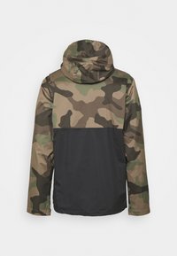 Camouflage jacket featuring a hood, made of smooth fabric. Upper half in green and brown camo, lower half solid black. Long sleeves.