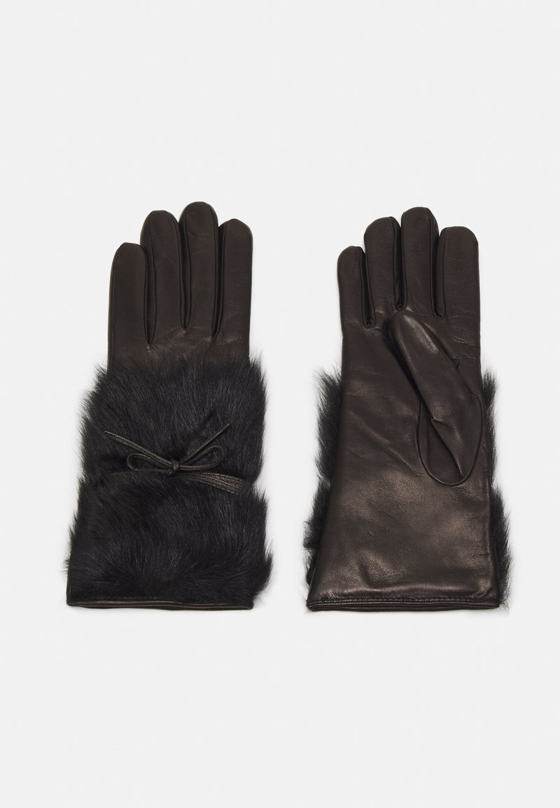 Guantes de cuero negro con un detalle de piel, que cuentan con un acento atado en la muñeca. Textura suave y diseño ceñido para mayor calor.
