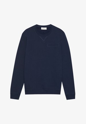 Paita sininen merimiestyyli, joka on valmistettu puuvillasta. Sitä koristaa pyöreä kaula-aukko, pitkät hihat ja pieni rintatasku, jossa on hienovarainen logoyksityiskohta.