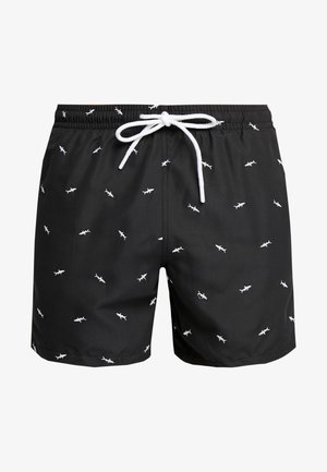 Shorts de bain noirs avec un motif de requins blancs, taille élastique et cordon blanc. Fabriqués en matériau léger et à séchage rapide.