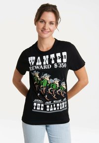 Black cotton t-shirt featuring a "WANTED" graphic with cartoon figures and text, short sleeves, and a crew neck design.