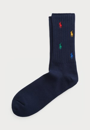 Navy ribbed socks made from cotton blend, featuring colorful embroidered polo logos in red, yellow, green, and blue.