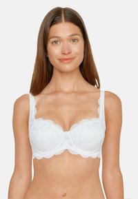 White lace bra with scalloped edges, underwire support, and decorative button detail at the center. Adjustable straps and sheer texture.