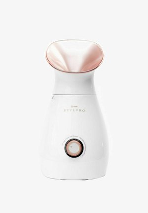 White facial steamer with a curved rose gold nozzle and control dial. The body is smooth with subtle branding and detail indicators.