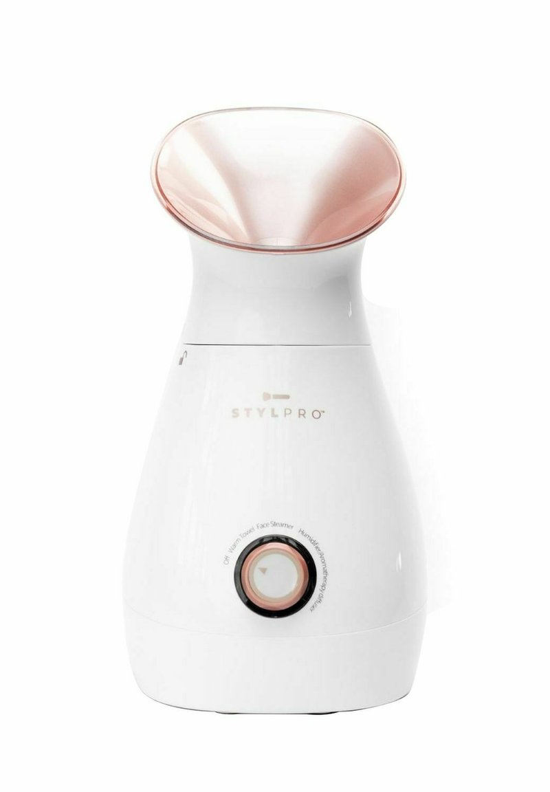 Vit ansiktsångmaskin med en svängd munstycke i roséguld och kontrollvred. Kroppen är slät med subtil varumärkesdesign och detaljerade indikatorer.