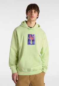 Hoodie vert menthe en tissu doux, avec une poche avant et un patch graphique floral avec des accents violets. Capuche avec cordon de serrage et coupe décontractée.