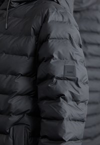 Rains LOHJA LONG PUFFER JACKET UNISEX - Manteau d'hiver - black