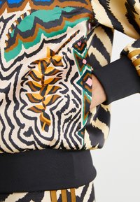 adidas Originals ADIDAS FARM RIO FIREBIRD TRACK - Treningsjakke - crystal sand