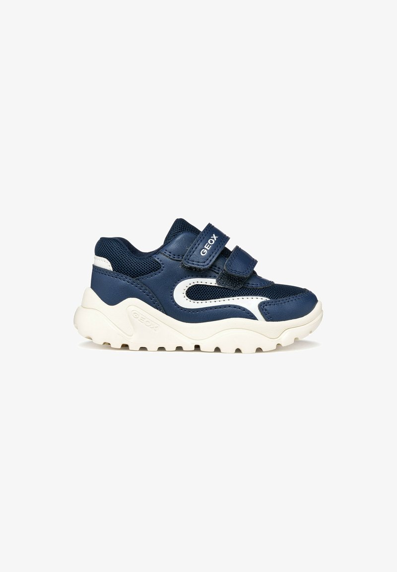 Baskets pour enfants bleu marine et blanc avec deux bandes Velcro et semelle blanche épaisse et texturée.